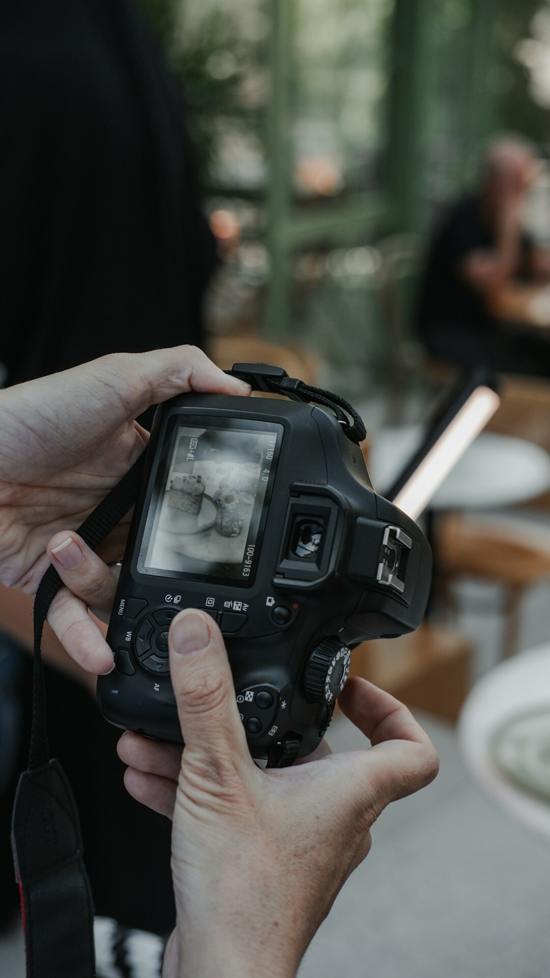 Photographer with professional camera covering an event