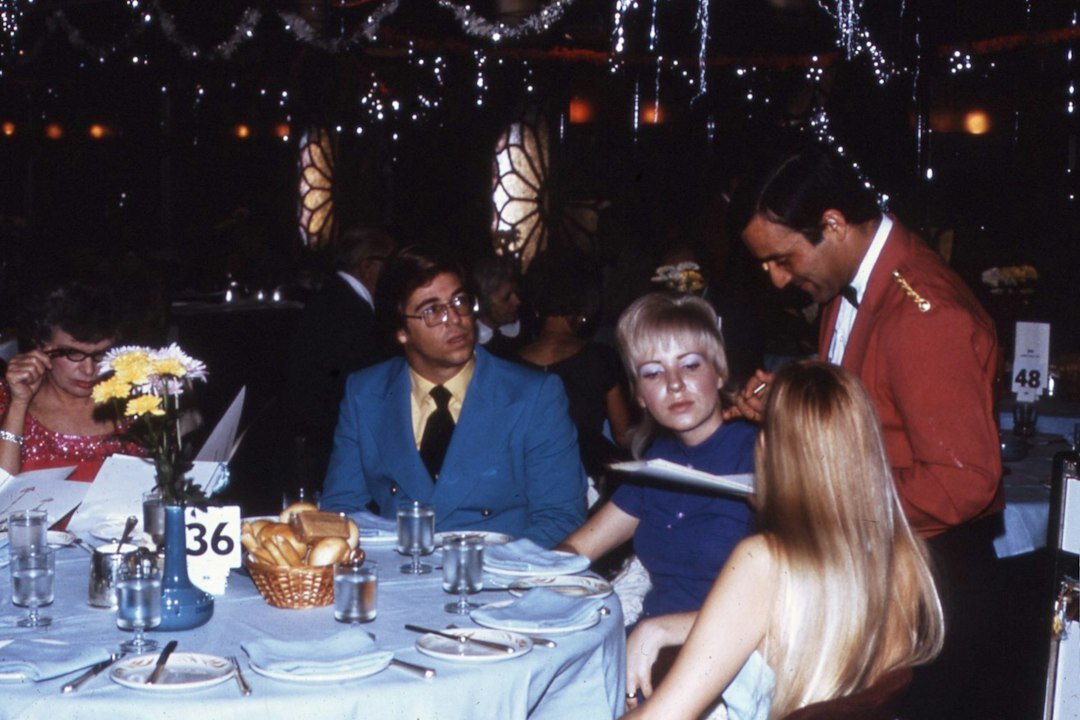 Elegant gala dinner event with guests in formal wear